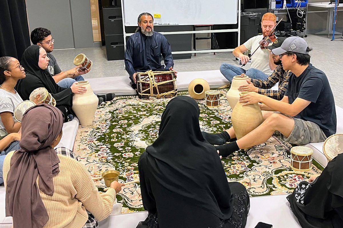 Ghazi Mulaifi and Layth Sidiq with NYUAD Arab Music students.