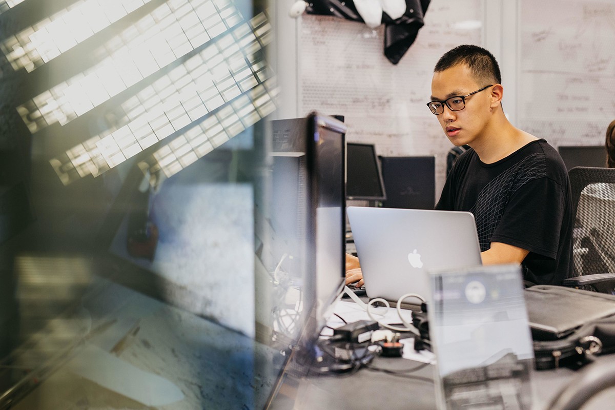 Student works on a laptop